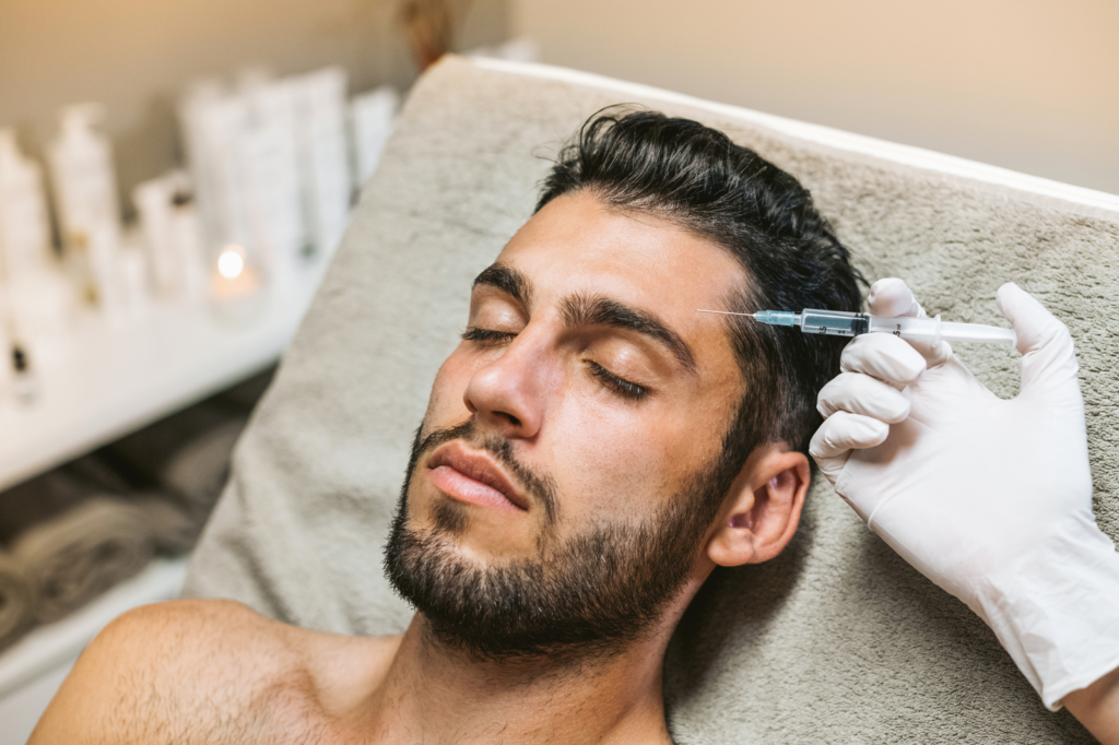 Male patient undergoing Botox treatment to reduce wrinkles.